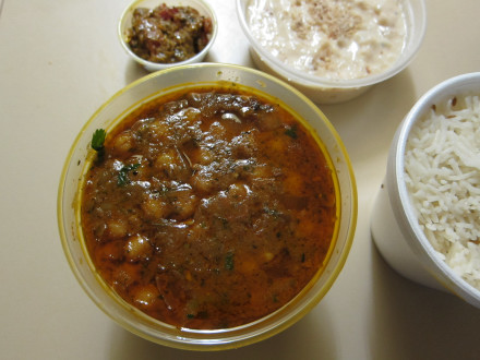 Chana masala in a takeout container